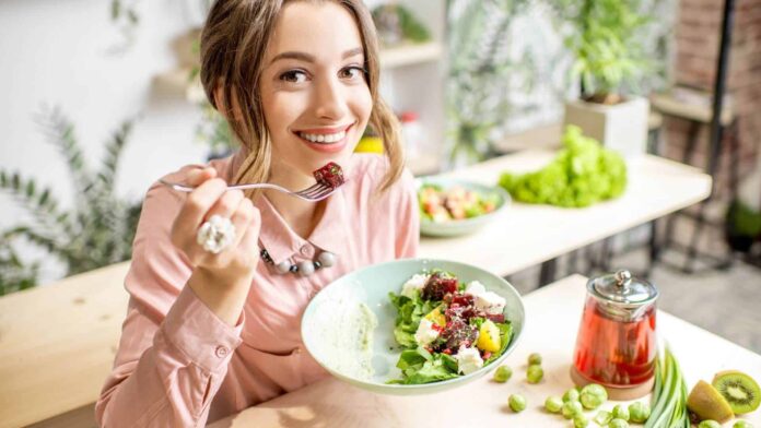 Woman eating Green Mediterranean Diet